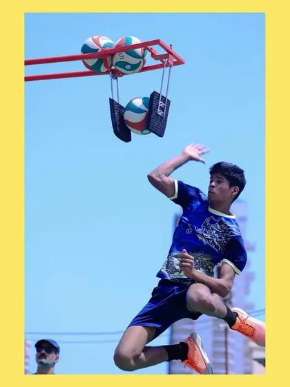 A young athlete airborne, practicing his spike approach with our training rig. This equipment allows for high-volume repetition to build muscle memory.