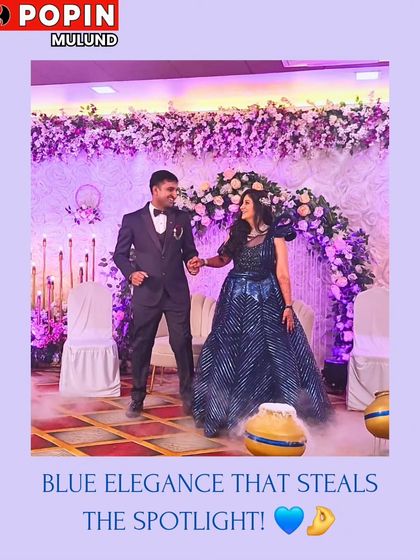 A happy client couple looking fabulous at their event. She is wearing a striking blue sequined gown that catches the light beautifully, showing how my rentals shine in real life.