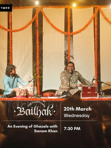 A full stage view during a ghazal night with Sanam Khan. You can see the complete setup with the vocalist on harmonium and me on tabla, creating a classic mehfil atmosphere.