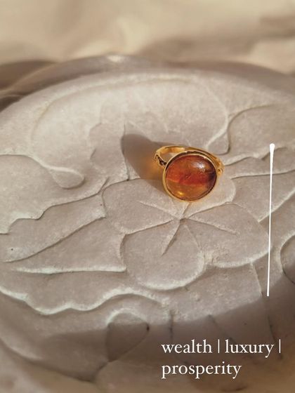 The Hessonite Garnet Sun Ring, a beautiful piece for manifesting wealth, luxury, and prosperity.