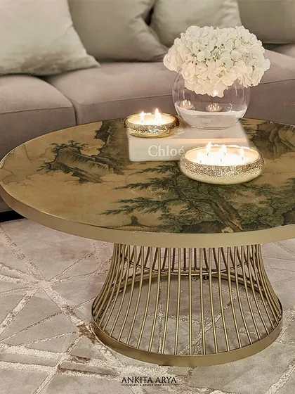 Another view of the glass-topped center table, showing how the printed artwork interacts with light and the surrounding decor. It adds a layer of depth and sophistication to the living space.