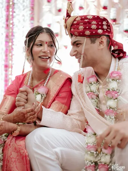 A candid moment from their wedding ceremony. The drapes are traditional and respectful of the rituals.
