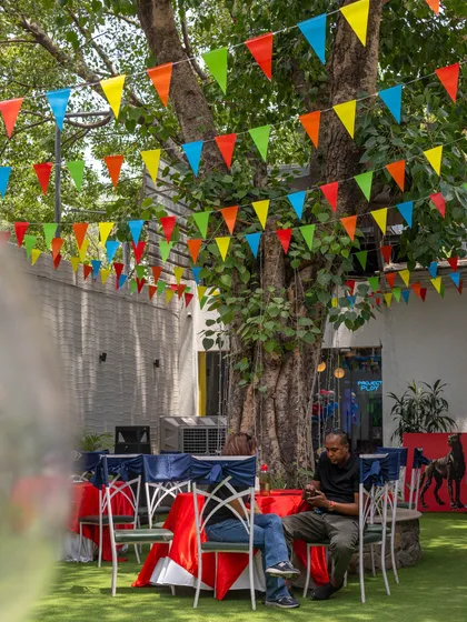 Even the seating area is part of the fun! Colorful bunting flags hang above the guest tables, ensuring the party atmosphere is felt throughout the entire venue.