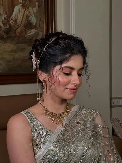 This angle highlights the soft tendrils I left out to frame the face, adding a touch of softness to the structured updo.