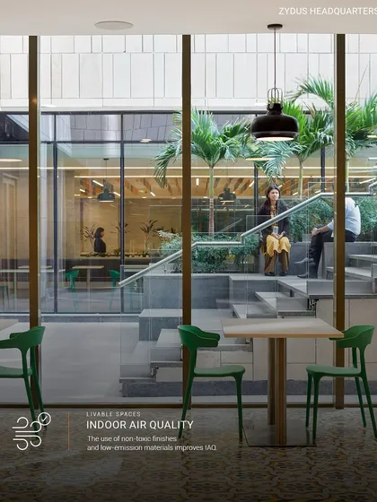 At the Zydus Headquarters, indoor air quality is paramount. We use non-toxic finishes and low-emission materials, and the design integrates green spaces like this internal courtyard to improve air quality and enhance employee well-being.