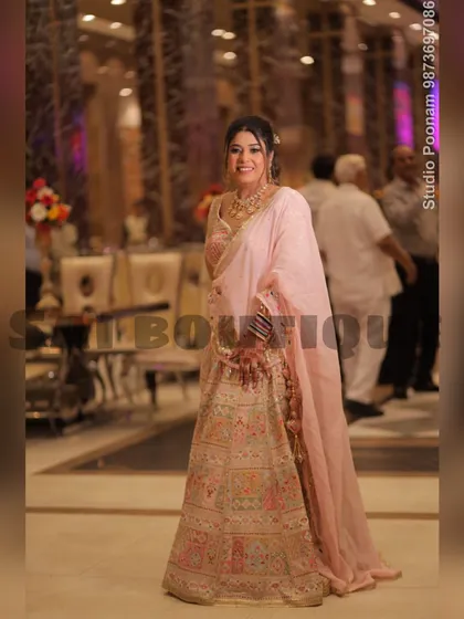 A full-length shot of this elegant pastel lehenga, showing how the soft colors and detailed craftsmanship create a sophisticated look.