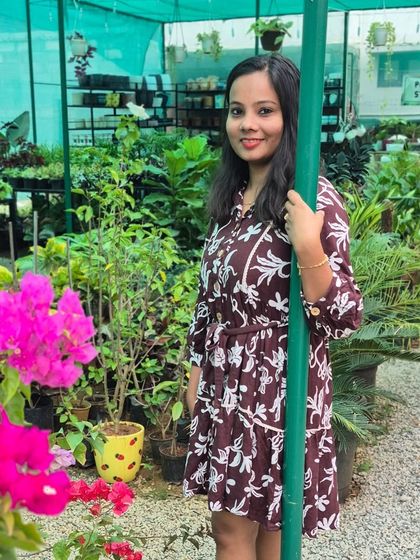 Me, in my happy place, surrounded by greenery at the garden center. Every day here feels real and full of life, a world away from my old corporate life.