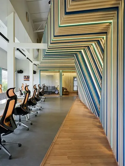 For the Kadence Office, we translated the company's identity into a physical space. The design is built around the concept of soundwaves, with coded striations flowing through the office to create a vibrant, immersive environment that is unique to the brand and supports a creative workflow.