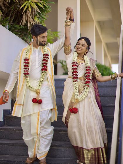 The happy couple descending the stairs after their wedding ceremony, hand in hand, ready to start their new life together.