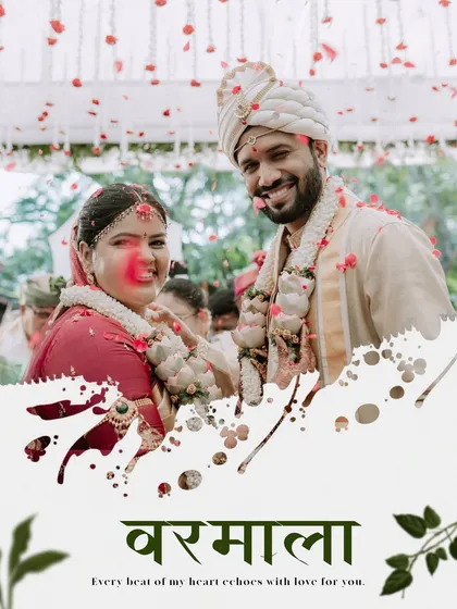 A joyful 'Varmala' or garland exchange ceremony, with the couple being showered in flower petals.