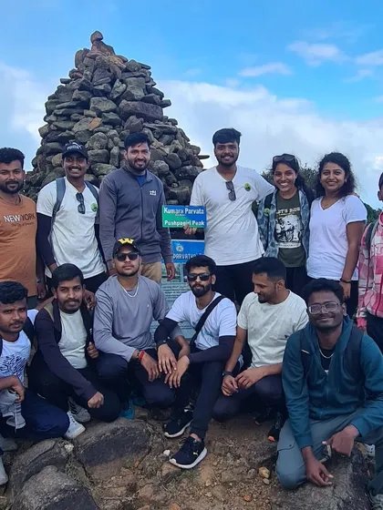 A group of friends at the Kumara Parvatha summit. Conquering this peak together is a bonding experience like no other.