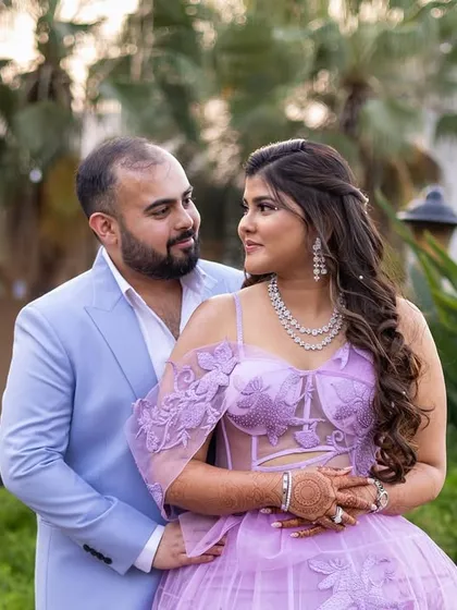 A sweet couple portrait. Kajol's glowing skin and soft purple eyeshadow tones tie in perfectly with her stunning gown.