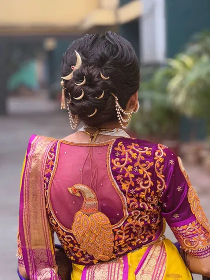 Another angle of the Maharashtrian bridal bun, highlighting the placement of the moon accessories and the traditional 'ambada' pin. This style is rich in cultural significance and looks stunning from every view.