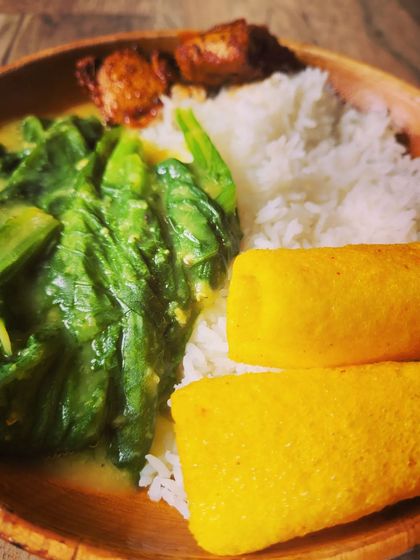 This angle highlights the yellow finger fryums, adding a fun and crunchy element to the meal.