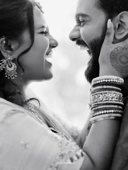 A duplicate of image 18, capturing a beautiful moment of shared laughter in monochrome.