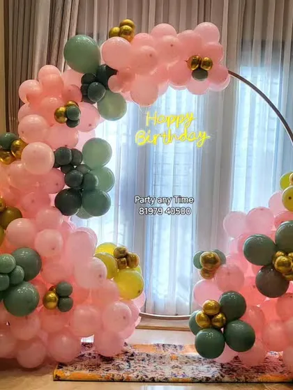 The full view of the unique organic balloon arch, perfect for a stylish birthday celebration at home.