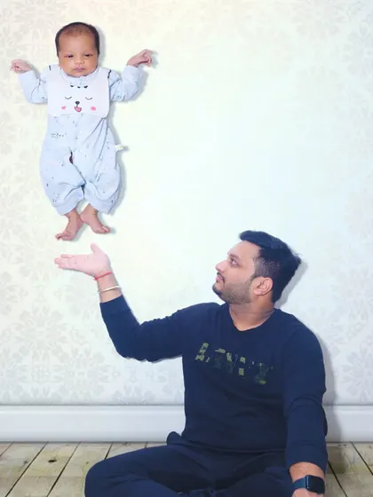 A fun and creative edit showing a father playfully levitating his newborn baby. I enjoy adding a touch of magic to your photos to make them truly one-of-a-kind.
