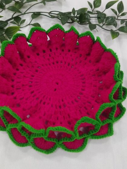 The rich pink and vibrant green contrast beautifully in this lotus aasan, ready to add a traditional touch to your sacred space.