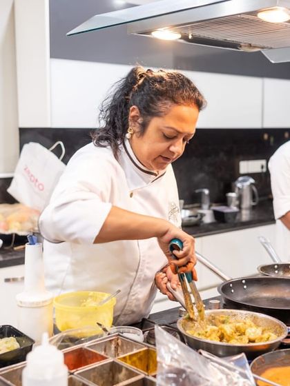 Co-founder and Chef Sharmistha leading the team during a busy service, ensuring every dish that goes out is perfect.