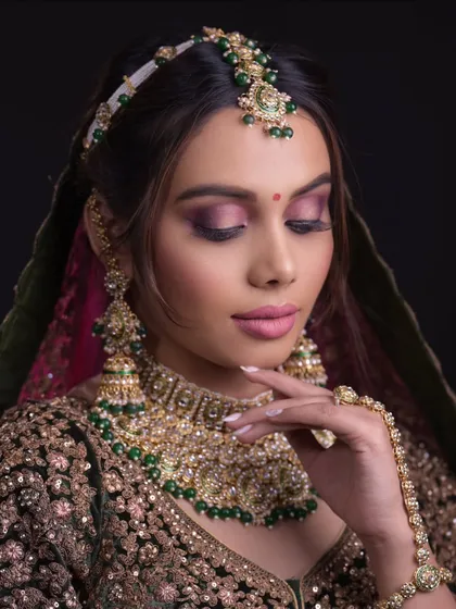 Another shot from the same series, highlighting the intricate jewelry and hand accessories.