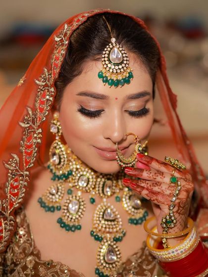Noor-E-Jahan. A close-up on the delicate details of her makeup, from the perfectly winged liner to the intricate nath.