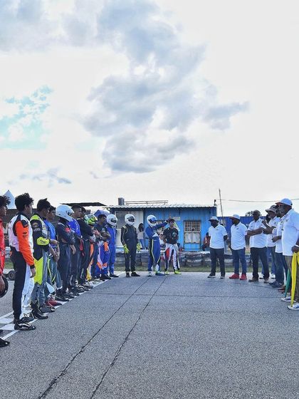 Drivers lined up on the grid, listening to final instructions from race officials. Professionalism and order are key to our event management.