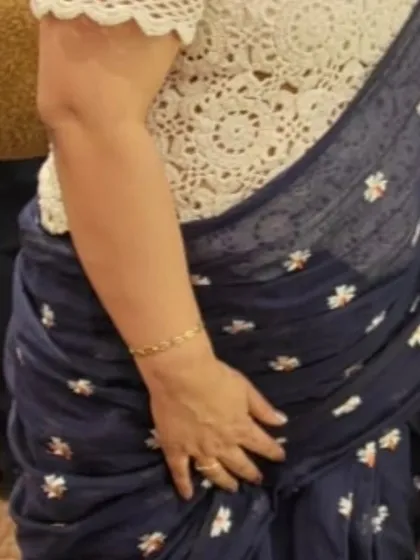 A crochet blouse can transform a traditional look. Here, my white lace top is paired with a beautiful navy blue saree, creating a modern and elegant fusion outfit. It’s a wonderful way to add a personal, handmade touch to festive wear.