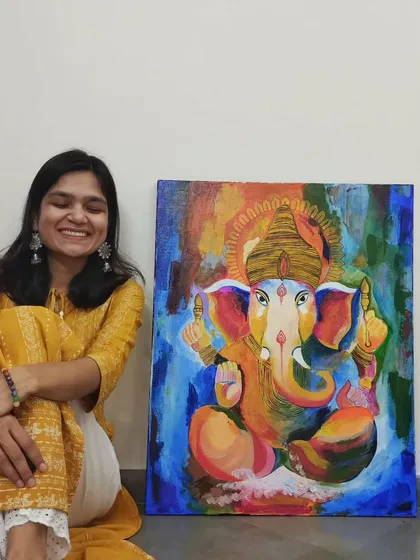 I love creating art that feels personal and joyful. Here I am with a custom Ganesha painting, commissioned as a housewarming gift. The vibrant, abstract style and rich colors were chosen to bring positive energy and a modern touch to my client's new home.