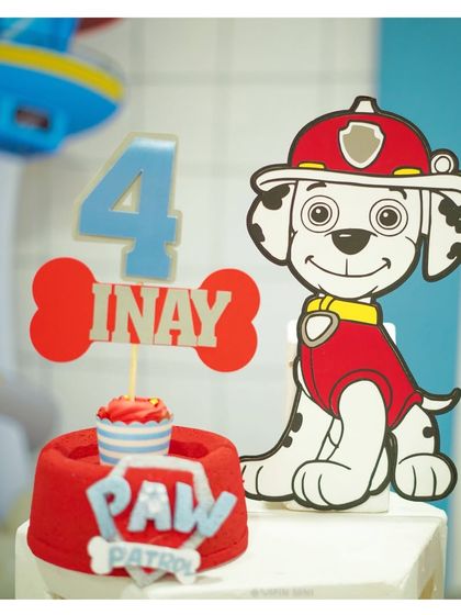Another detailed shot of the Paw Patrol cake topper, with a 'PAW' logo and a Marshall cutout, perfect for any fan of the show.
