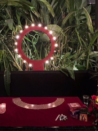 The calm before the storm of readings at the Accel event. The lit-up ring light against the green backdrop, with my cards and candles ready, set a beautiful and professional tone for the evening.