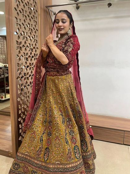 This mustard and maroon lehenga offers a unique color combination for the bride who wants to stand out.