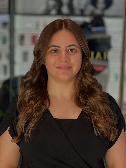 A frontal view of the beautiful warm brown global colour. The shade is even from roots to ends, providing a perfect, polished look.