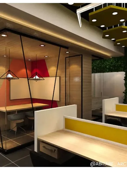 A glass-enclosed meeting pod within an open-plan office. This design provides a quiet space for collaboration without disrupting the overall flow, using bold color accents to define the zone.