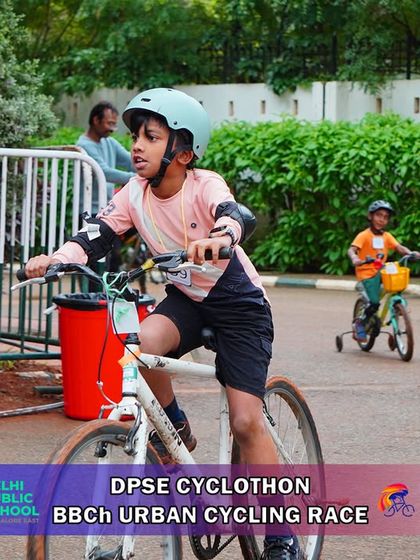 A young rider confidently pedals past a maintenance sign during the race. Our courses are well-marked and supported by volunteers to ensure a smooth experience for everyone.