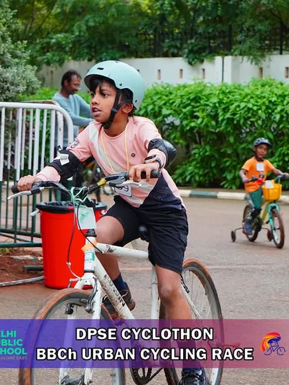 A young rider confidently pedals past a maintenance sign during the race. Our courses are well-marked and supported by volunteers to ensure a smooth experience for everyone.