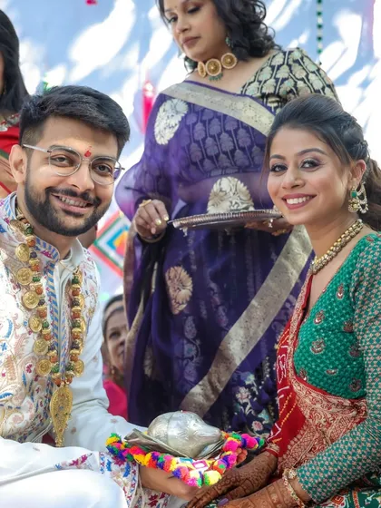 A happy moment from a wedding ceremony. The client's makeup is fresh and radiant, lasting through all the rituals.