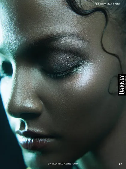'Divine Frequency' for Darkly Art Magazine. An extreme close-up focusing on skin texture, highlighting the specular sheen and wet-look hair with precise lighting.