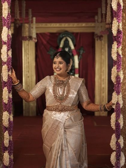 The bride making her grand entrance. Her entire look, from the saree to the makeup, is cohesive and traditionally beautiful.