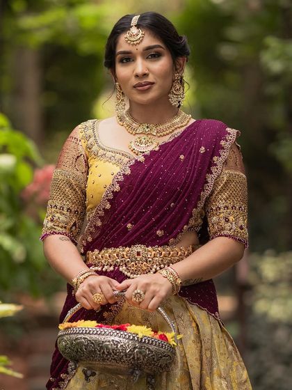 A close-up of the intricate jewelry and the soft, sophisticated makeup.