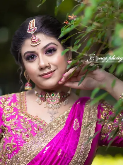 A beautiful, natural-light portrait that highlights the fresh and dewy makeup finish.