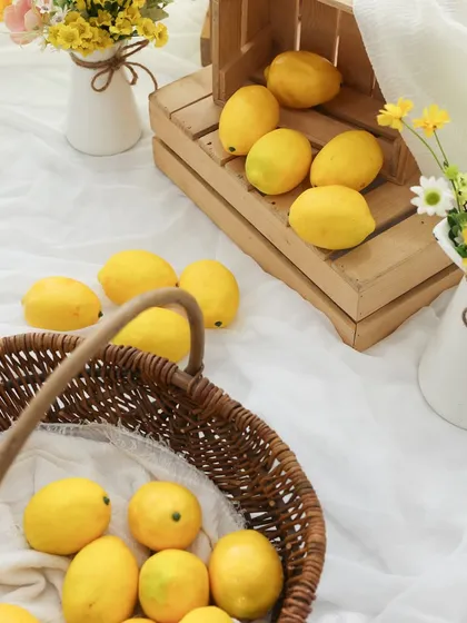 Getting ready for a splash of sunshine. Here’s a look at the props for our popular lemon garden theme. The wicker baskets, wooden crates, and fresh yellow flowers create a cheerful and rustic vibe.