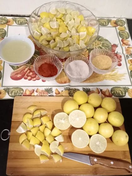 The process of making lemon pickle begins with cutting fresh lemons and mixing them with our special spice blend. It's all done by hand.