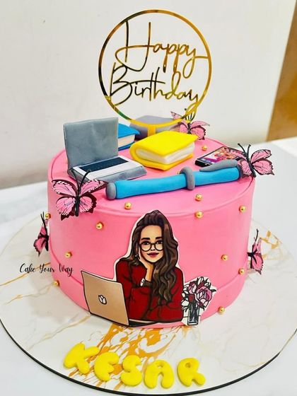Study vibes, birthday edition. This custom cake was made for a true multitasker, with a fondant laptop, books, and glam butterflies.