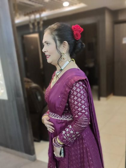 This client is glowing with her finished party makeup and hairstyle. The look is polished and perfect for any special occasion.