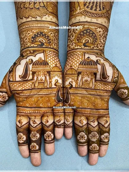 This symmetrical bridal design is a story told on two hands, featuring palace architecture and majestic peacocks. It represents the grand, traditional style I love to create for a bride's special day.
