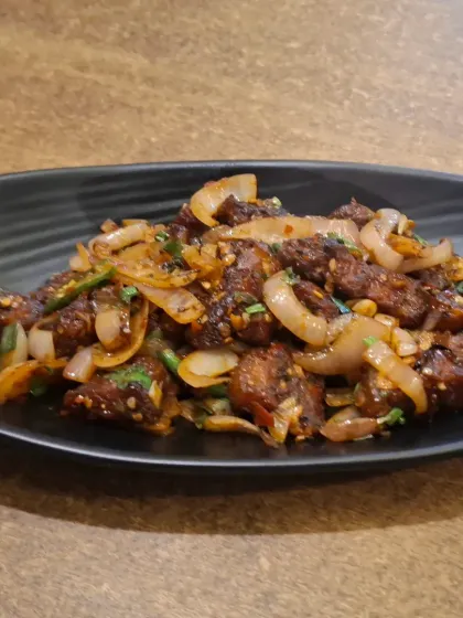 My Spicy Pork Dry Fry is a customer favourite. It's made with tender pork, lots of onions, and a mix of traditional spices that give it a real kick. A perfect starter to get your meal going.