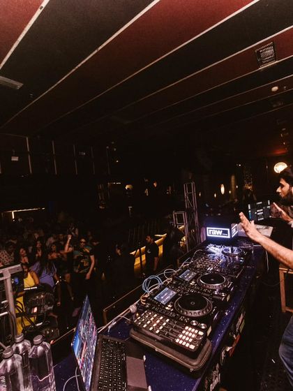 A view from my side of the decks, with the crowd going wild. Moments like these are why I love what I do. It's pure, unfiltered energy.