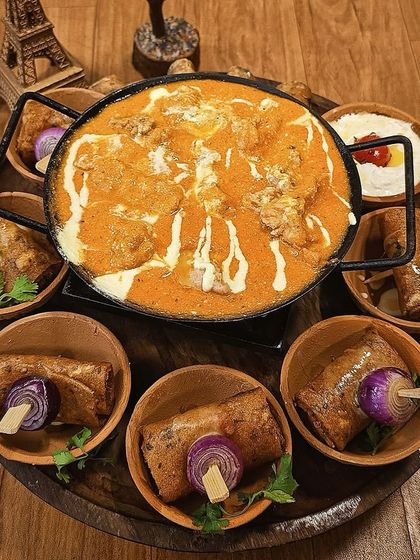 Our signature butter chicken served as a fondue with delectable rolls for dipping. This is a perfect example of how we bring gourmet indulgence straight to your table.