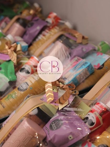 Confectionery return favors we created for a Roka ceremony. These baskets are packed with an assortment of snacks and treats, providing a delightful gift for guests to take home.