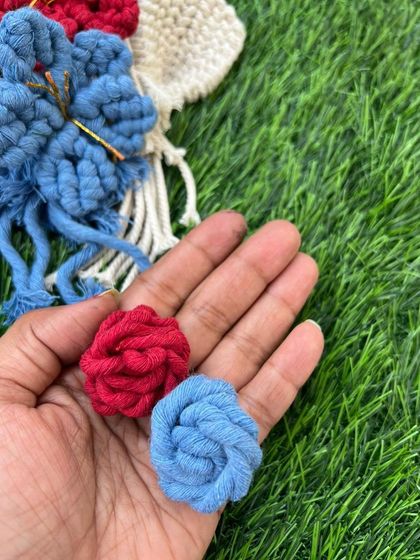 A close-up of the small, tight knots I use to create the center of my macrame flowers. These little details add so much character.